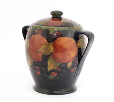 Lot 64 - A William Moorcroft 'Pomegranate' biscuit barrel and cover