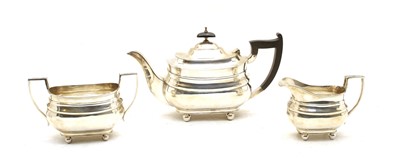 Lot 186 - A silver three piece tea service