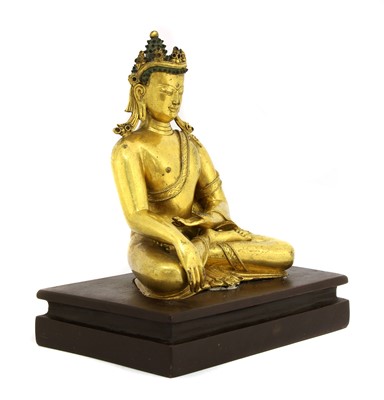 Lot 214 - A Chinese gilt-bronze Shakyamuni Buddha