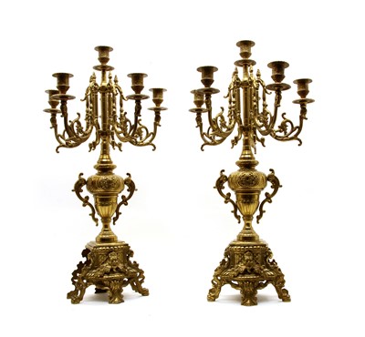 Lot 173 - A pair of Rococo-style brass six-light candelabra