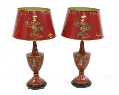 Lot 423 - A pair of red toleware-style table lamps and shades