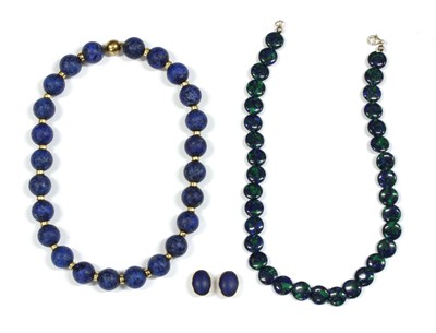 Lot 409 - A single row uniform lapis lazuli bead necklace