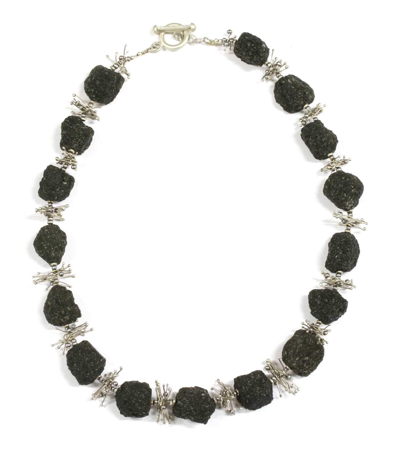 Lot 78 - A contemporary silver lava stone and cultured freshwater pearl necklace