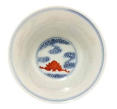 Lot 149 - A Chinese blue and iron-red cup