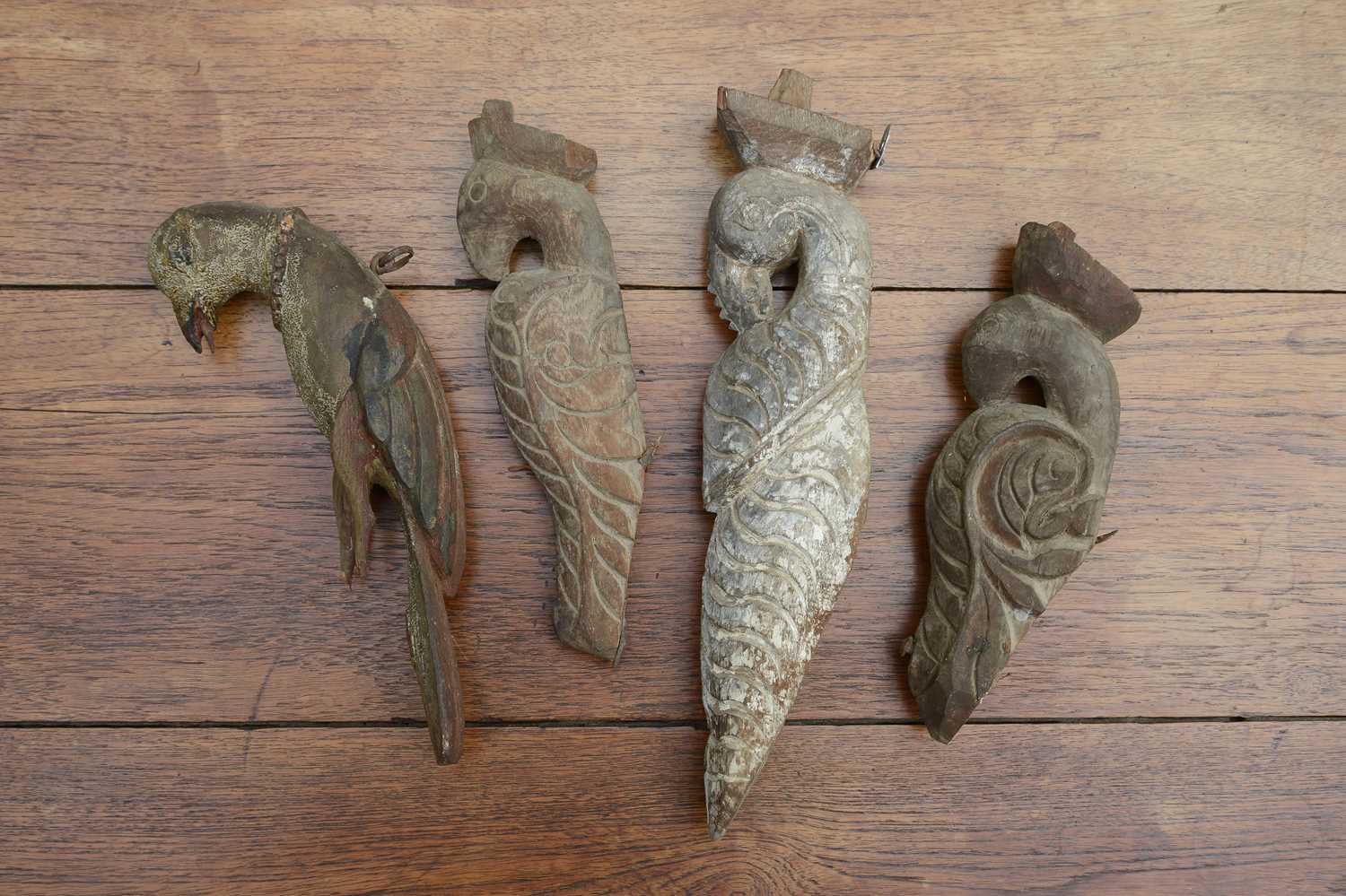 Lot 17 - Four carved wooden figures of birds