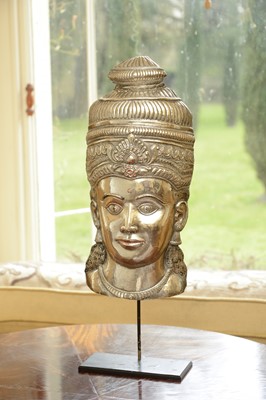 Lot 72 - A white metal relief mask
