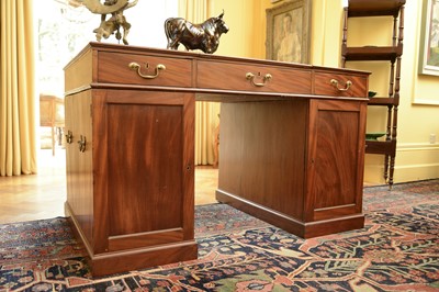 Lot 83 - A strung mahogany twin pedestal partners' desk