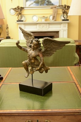 Lot 118 - A carved wooden polychrome and gilt-decorated figure of an angel