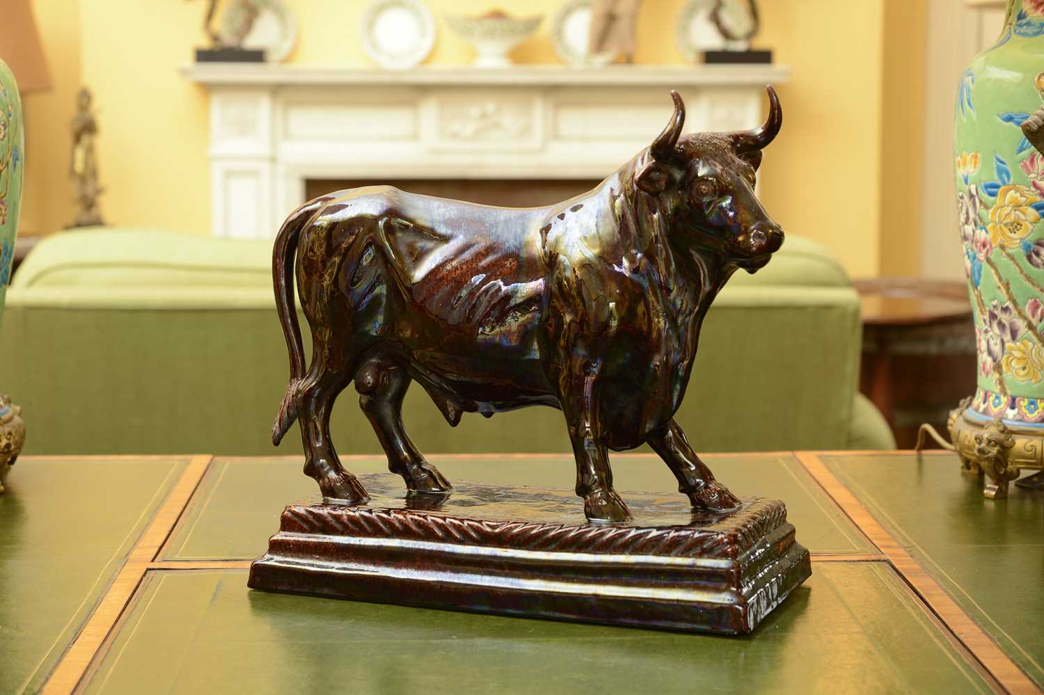 Lot 85 - A large brown-glazed pottery model of a bull