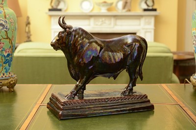 Lot 85 - A large brown-glazed pottery model of a bull