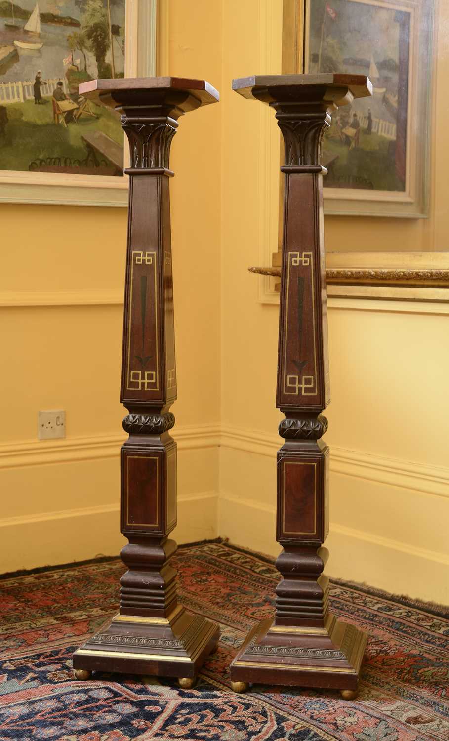 Lot 101 - A pair of mahogany torchères in the manner of George Bullock