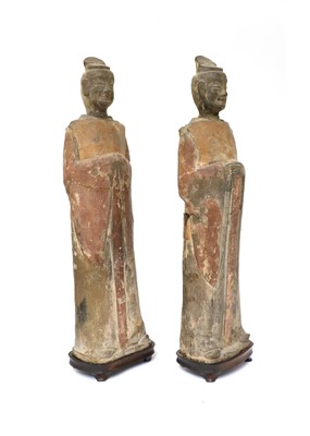 Lot 15 - A pair of Chinese pottery figures