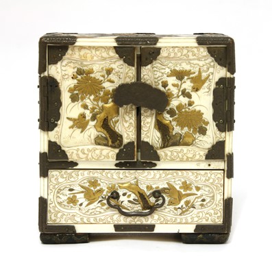 Lot 294 - A Japanese ivory and gold lacquered table cabinet