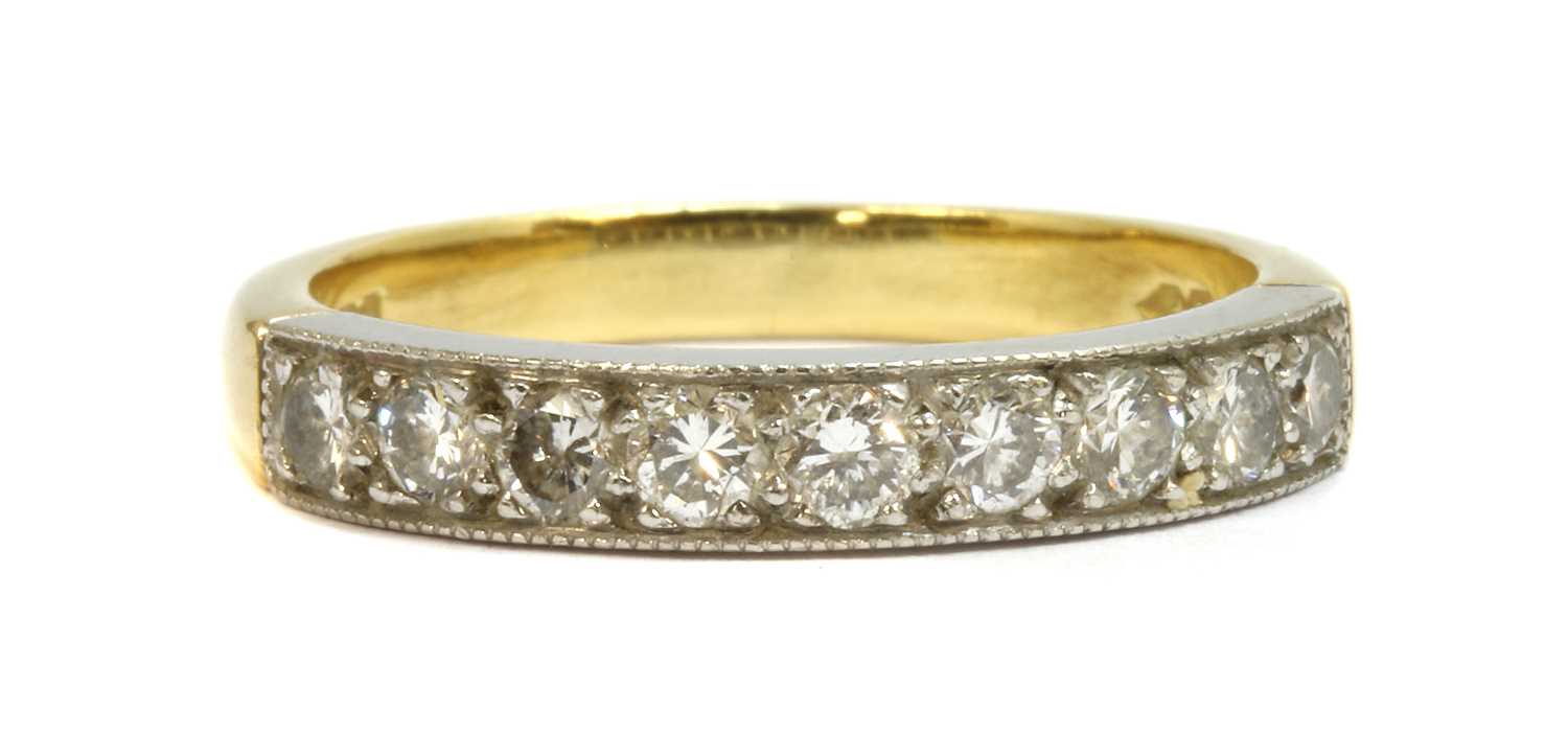 Lot 67 - An 18ct gold diamond half eternity ring