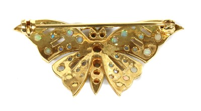 Lot 22 - A 9ct gold opal and emerald butterfly brooch