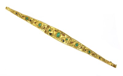 Lot 188 - A gold emerald, sapphire and ruby bracelet