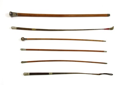 Lot 99S - Three military malacca canes and two leather and braided whips