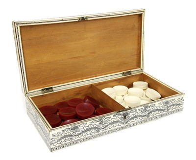 Lot 297 - An Anglo Indian Vizagaptam ivory and sandalwood folding games board and box