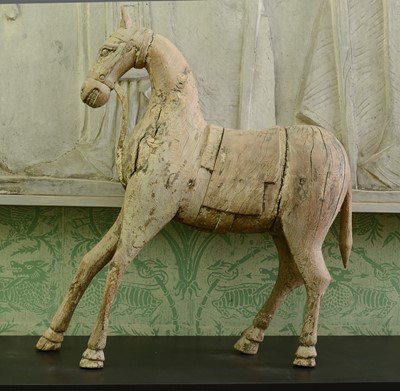 Lot 51 - A carved wooden figure of a horse