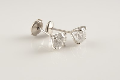 Lot 365 - A pair of white gold single stone diamond stud earrings