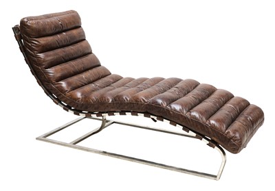 Lot 582 - A tan leather and chrome lounger