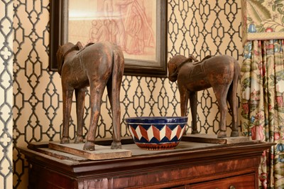 Lot 268 - A pair of carved wooden horses