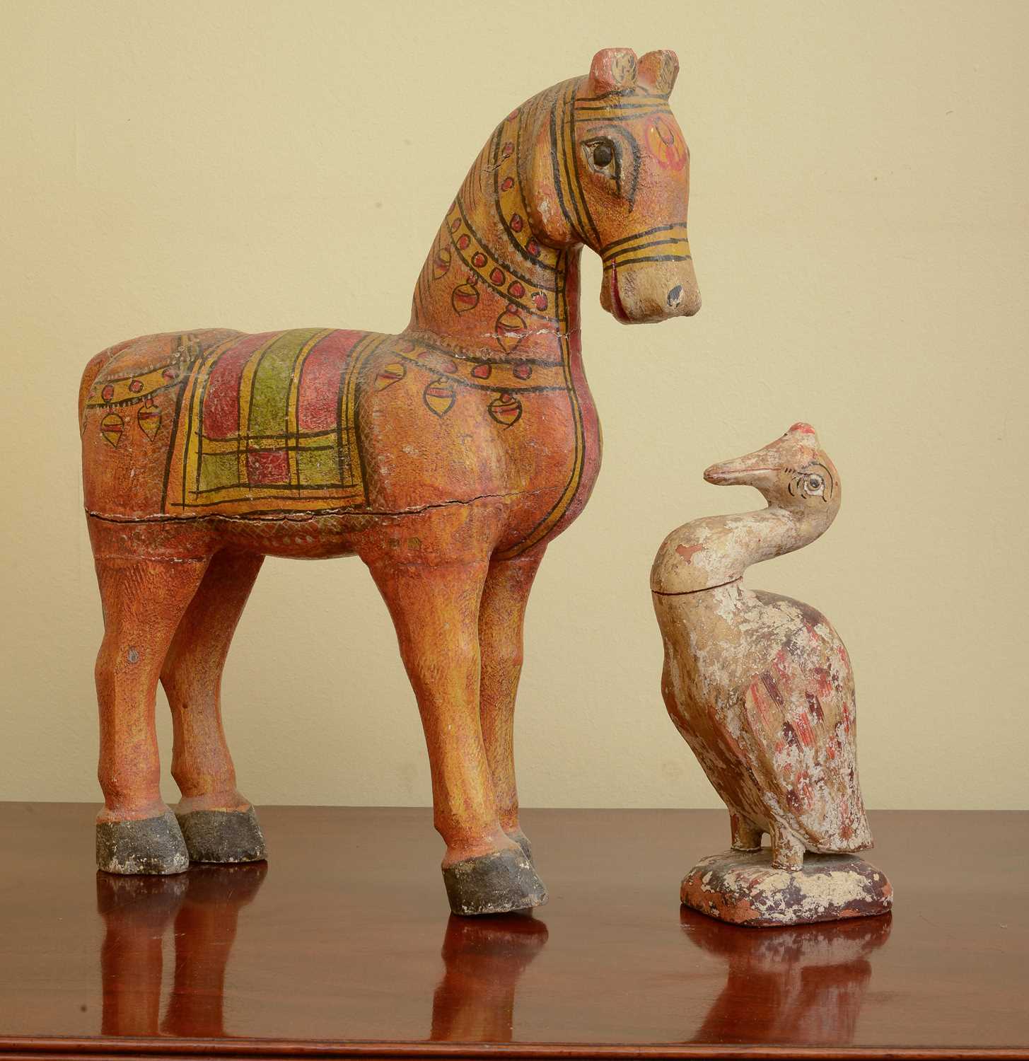 Lot 284 - A carved and painted wooden horse