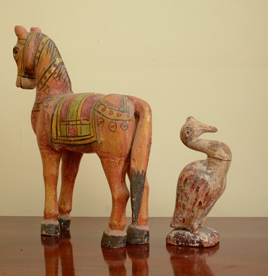 Lot 284 - A carved and painted wooden horse