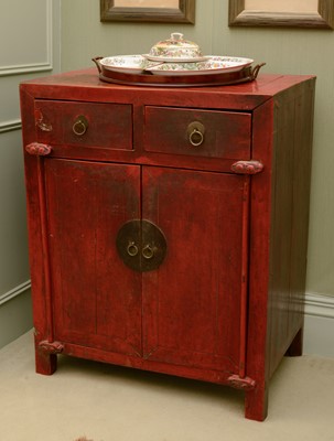Lot 351 - A Chinese red-lacquered low cupboard