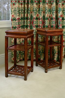Lot 353 - A pair of Chinese elm bedside tables or urn stands