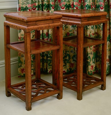 Lot 353 - A pair of Chinese elm bedside tables or urn stands