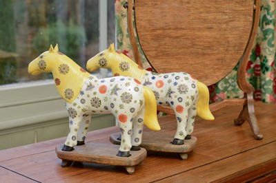 Lot 355 - A pair of Chinese porcelain horses