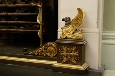 Lot 360 - A French Empire bronze and gilt-bronze fire kerb