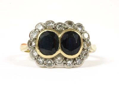 Lot 197 - An 18ct gold sapphire and diamond double cluster ring