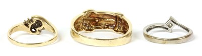Lot 264 - A 9ct gold diamond set buckle ring
