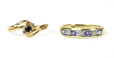 Lot 362 - A gold sapphire and diamond three stone ring