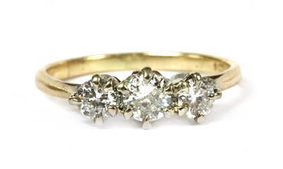 Lot 170 - A gold three stone diamond ring