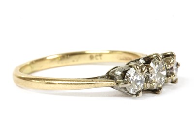 Lot 170 - A gold three stone diamond ring