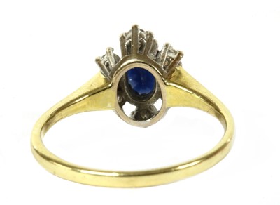 Lot 196 - An 18ct gold sapphire and diamond cluster ring