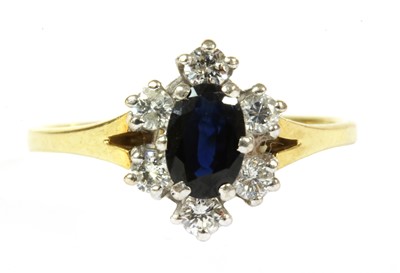 Lot 196 - An 18ct gold sapphire and diamond cluster ring