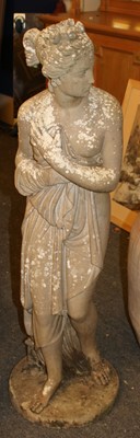Lot 392 - A composite stone figure of a semi-clad female in classical dress