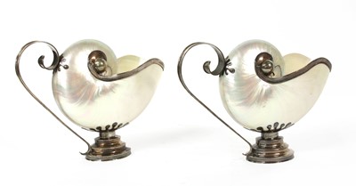 Lot 29 - A pair of Tiffany sterling silver-mounted shell ewers
