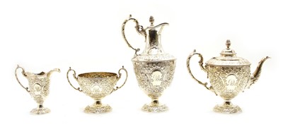 Lot 208 - A four piece silver plated embossed tea set