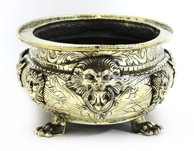 Lot 38 - An embossed brass wine cooler