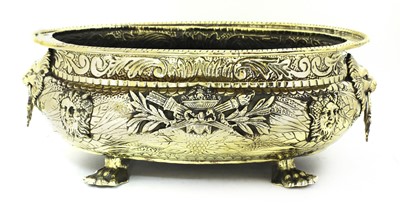 Lot 38 - An embossed brass wine cooler