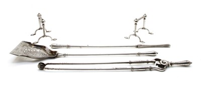 Lot 255 - A set of polished steel fire tools