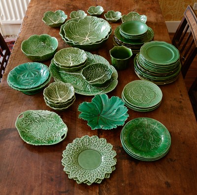 Lot 225 - A collection of English and Continental green-glazed stoneware plates, bowls and dishes