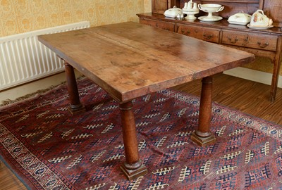 Lot 215 - A walnut and fruitwood table