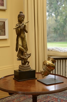 Lot 114 - An Indian gilt-bronze figure