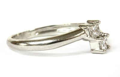 Lot 223 - A platinum two stone diamond ring
